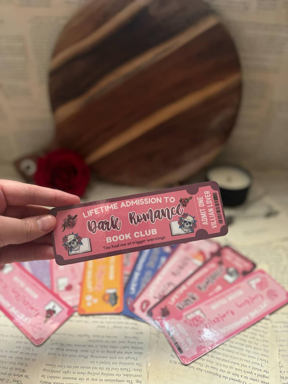 Book Club bookmark featuring dark pink admission ticket design and graphic text "Lifetime admission to dark romance book club; you had me at trigger warnings"