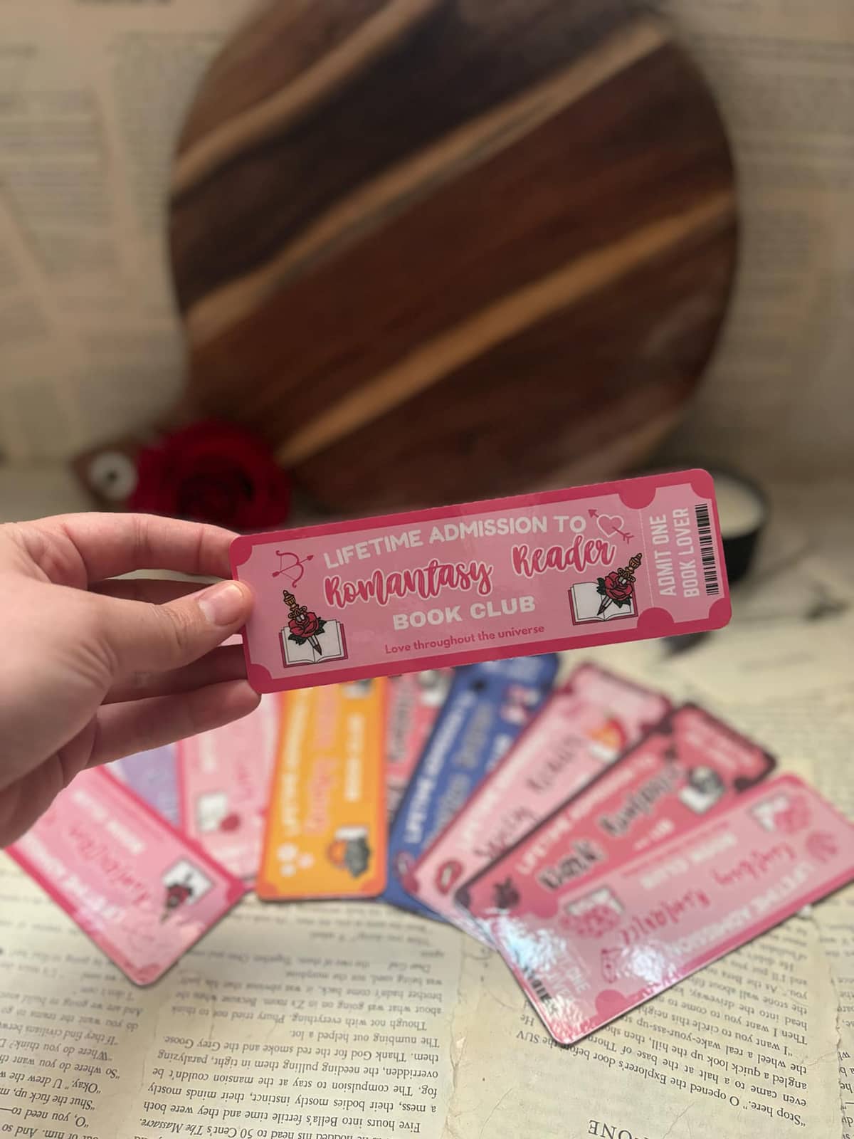 Book Club bookmark featuring pink admission ticket design and graphic text "Lifetime admission to romantasy reader book club; love throughout the universe"