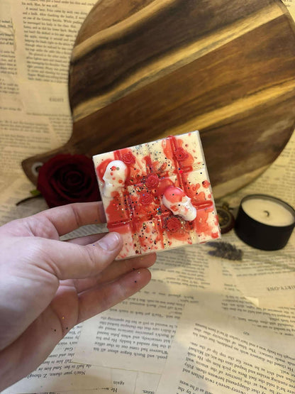 White wax melt block with red splatters and skulls